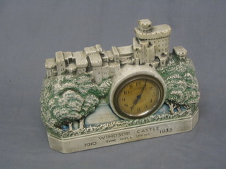 An Art Deco 8 day time piece with silvered dial contained in a plaster case in the form of Windsor castle to commemorate the Silver Jubilee of King George V