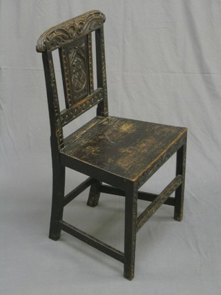 A Victorian  oak bar back chair with panel to the centre carved a head of a Monarch