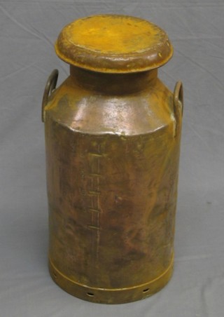 An old copper milk churn marked Unigate Creameries Ltd