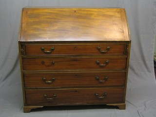 A Georgian mahogany bureau with fall front revealing a well fitted interior with drawers, above 3 long graduated drawers, raised on bracket feet 44" (warp to fall front, ply wood back and replacement bracket feet)