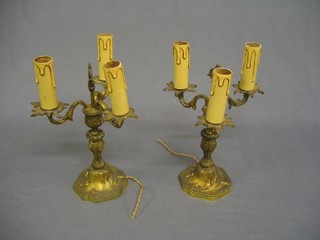 A pair of gilt metal Rococo style 3 branch table lights 