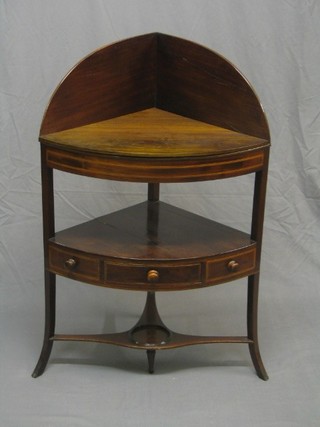 A George III mahogany corner wash stand with raised back, fitted 4 bowl recepticals, the base fitted a drawer flanked by a pair of dummy drawers above an undertier, raised on outswept supports, 27" (crack to back and potboard)