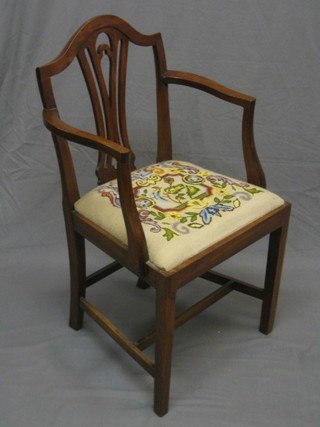 A 19th Century mahogany Hepplewhite style carver chair  with pierced vase splat back and Berlin wool work upholstered seat, raised on square tapering supports
