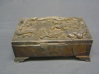 A rectangular antimony box decorated a dragon with hinged lid 9"