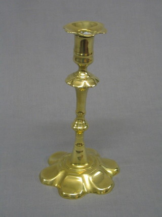 A 17th Century style brass petal based candlestick 10"