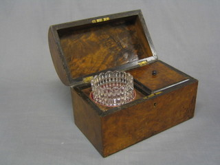 A Victorian figured walnut dome shaped tea caddy, the interior fitted a mixing bowl 10"