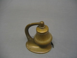 A brass mounted table bell, engraved "Presented to Barbara Dutton Forshaw by W M Osborne Ltd on the occasion of the launching of Cardigrae III 8 July 1947" 