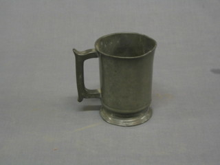 A Victorian pewter pint tankard, the base engraved a swan