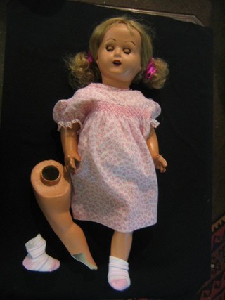 A composition headed doll with open and shutting eyes and open mouth