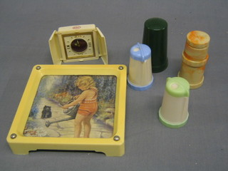 A  Smiths travelling clock in a white Bakelite case marked ABC (hinges f), a white Bakelite square teapot stand 6", a Bandalsta 2 piece Bakelite condiment set, a green Bakelite pepper pot and a Bandalsta marble finished Bakelite pepper pot