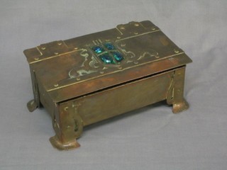 A Liberty's style Art Nouveau planished copper trinket box with hinged lid set hard stones, raised on bracket feet 10"