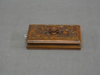 A 19th Century Continental carved wooden stamp case with hinged lid, the base marked Biglstafel 4"