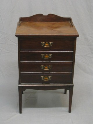 An Edwardian mahogany sheet music chest with three-quarter gallery and 4 long drawers, raised on square tapering supports 20"