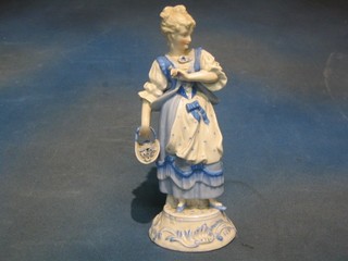 A 19th Century Continental porcelain figure of a girl with basket of flowers (f) 11"