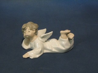 A Lladro figure of a reclining angel, base marked 8-7N 6"