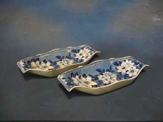 A pair of 19th Century Rogers blue and white floral patterned asparagus dishes, 11 1/2" (both chipped)