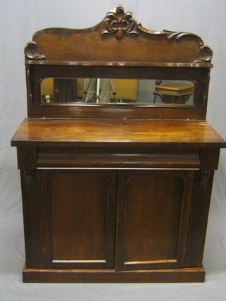 A Victorian rosewood chiffonier with raised mirrored back, the base fitted a drawer above a double cupboard, raised on a platform base 42" (missing 2 sections of veneer approx 3" x 1/4")