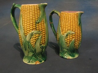 A pair of Majolica style jugs in the form of sweetcorn 10" and 8" (both with chips, 1 handle f and r)