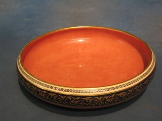 A circular Royal Doulton bowl with purple ground, blue and gilt banding, the base marked Doulton Made in England 11"