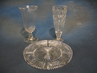 A circular cut glass tray 11", a do. trumpet shaped vase 10" and 1 other vase 10"