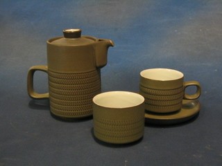 A 42 piece Denby Chevron pattern tea service comprising double ended dish 13", 4 side plates 8", 7 tea plates 6 1/2", jug, hotwater jug, 14 cups and 14 saucers and a sugar bowl