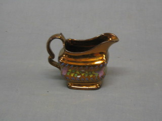 A 19th Century copper lustre cream jug 4"