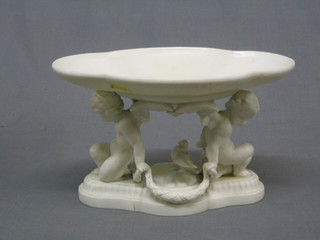 A Minton Parian boat shaped tazza supported by 2 cherubs 10 1/2" (f and r)