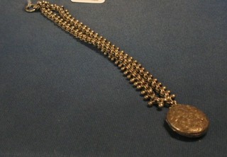 A Victorian silver chain hung a locket