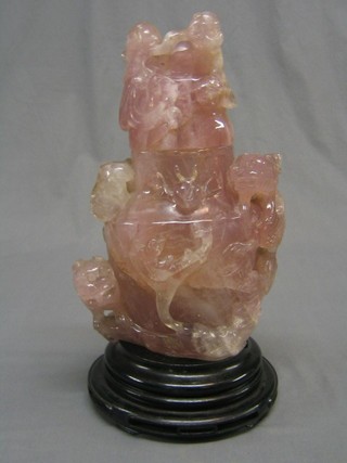 A pink carved hardstone vase and cover decorated a dragon 13"