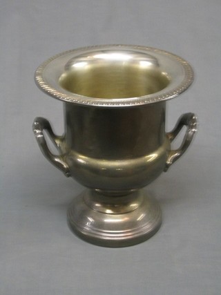 A twin handled silver plated wine cooler