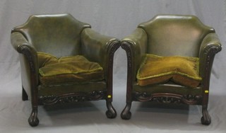 A pair of Georgian style show frame mahogany library chairs upholstered in green hide