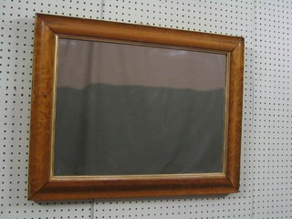 A 19th Century rectangular plate mirror contained in a maple frame 25"