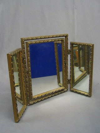 A 20th Century triple plate dressing table mirror contained in a gilt frame