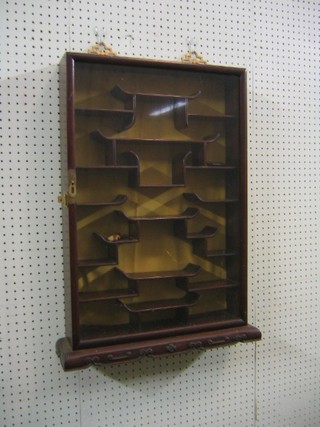 A 20th Century Eastern Padouk wood painted display cabinet, the interior fitted shelves 18"
