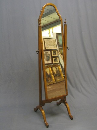 A 1930's Queen Anne style arch shaped plate cheval mirror contained in a mahogany swing frame (mirror some spots)