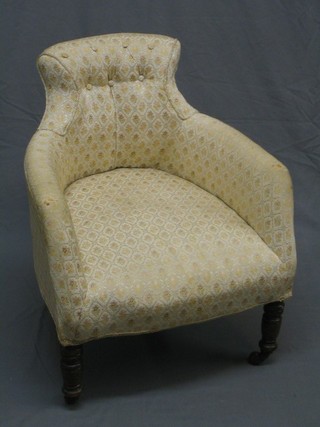 A Victorian mahogany tub back chair upholstered in cream buttoned material
