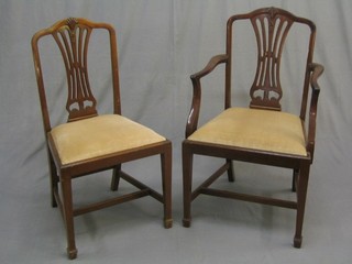 A set of 8 19th/20th Century Hepplewhite style camel back dining chairs with pierced vase splat backs and upholstered drop in seats, raised on square tapering supports ending in spade feet