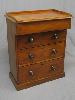 A Victorian mahogany chest with three quarter gallery, the upper section fitted a secret drawer above 3 long drawers with tore handles 29" (made up)