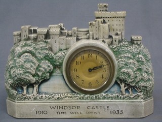 An Art Deco 8 day time piece with silvered dial contained in a plaster case in the form of Windsor castle to commemorate the Silver Jubilee of King George V