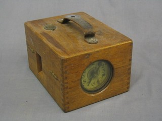 A German pigeon racing clock by Benzing contained in an oak case