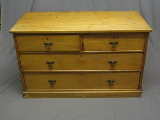 A 19th Century aesthetic movement elm chest of 2 short and 2 long drawers, raised on a platform base 48"