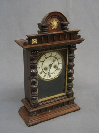 An American 8 day striking shelf clock with Roman numerals contained in a pine shaped case