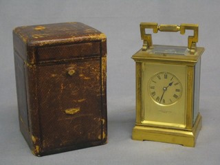 A handsome 19th Century French 8 day repeating carriage clock with gilt metal dial striking on a gong, contained in a gilt metal case, the dial marked James Crichton Paris, the reverse marked EM & Co, complete with leather carrying case