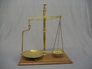 A large pair of 19th Century brass scales by Lock Bros. with mahogany base