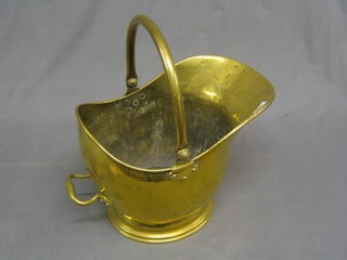 A brass helmet shaped coal scuttle (holes to bottom)