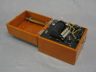 A battery operated Bristol coil shock machine contained in a mahogany case