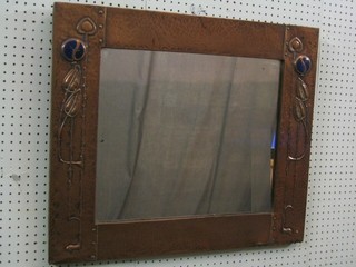 A rectangular Art Nouveau mirror contained in a planished copper frame 27"