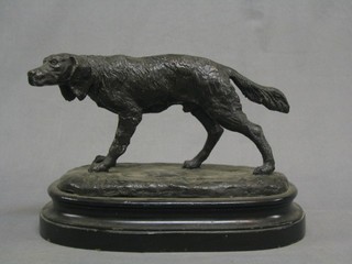 A modern bronze figure of a standing setter, raised on an oval base 13"