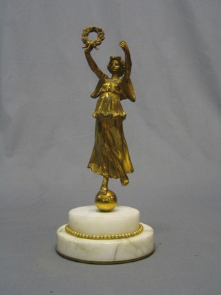A 19th Century gilt bronze figure of a standing lady with garland of flowers, raised on a white circular stepped marble base, 12"