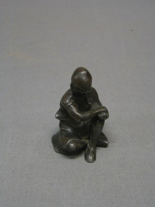 A 19th Century Oriental lead and bronze figure of a seated gentleman  2 1/2"